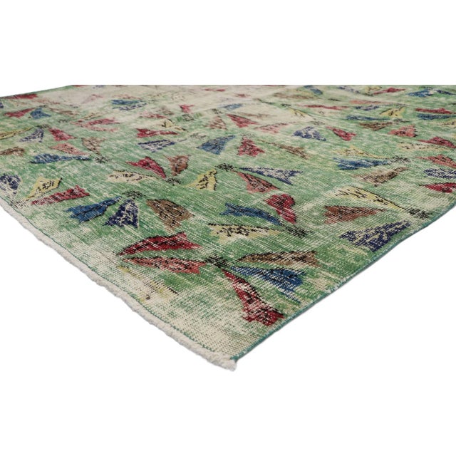 Zeki Muren distressed vintage Turkish Sivas rug with Art Deco style 05'08 x 08'09. Displaying asymmetrical spontaneity and...