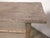 A beautifully rustic console table crafted from solid pinewood, dating to the first half of the 20th century. The long,...