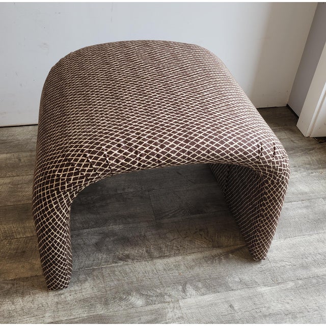 Beautiful waterfall bench in the style of Karl Springer is upholstered in a brown cotton lattice print. The small...