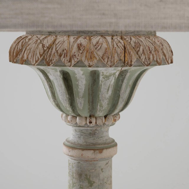 Delicate and ornate, this carved wooden floor lamp brings an element of French whimsy to an interior. Made at the turn of...