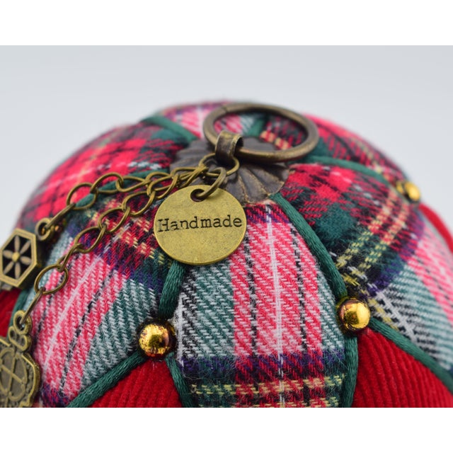 This rustic-style Christmas ornament has been handcrafted, making each one unique. The materials used for its creation are...