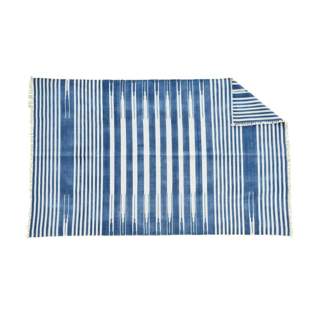 Made from naturally dyed 100% cotton yarn, these dhurrie rugs have been handwoven by skilled craftsmen in Jaipur. The age...