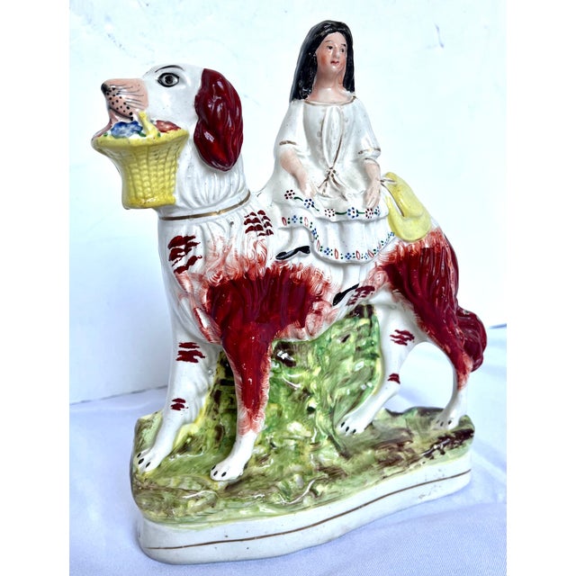 Charming and rare mid-to-late 19th-century Victorian English Staffordshire pottery flatback figurine. This delightful...