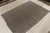 Originating between 1950-1960, a (9x10) vintage kilim rug from Turkey. Handwoven in wool, simple gray tones play with...