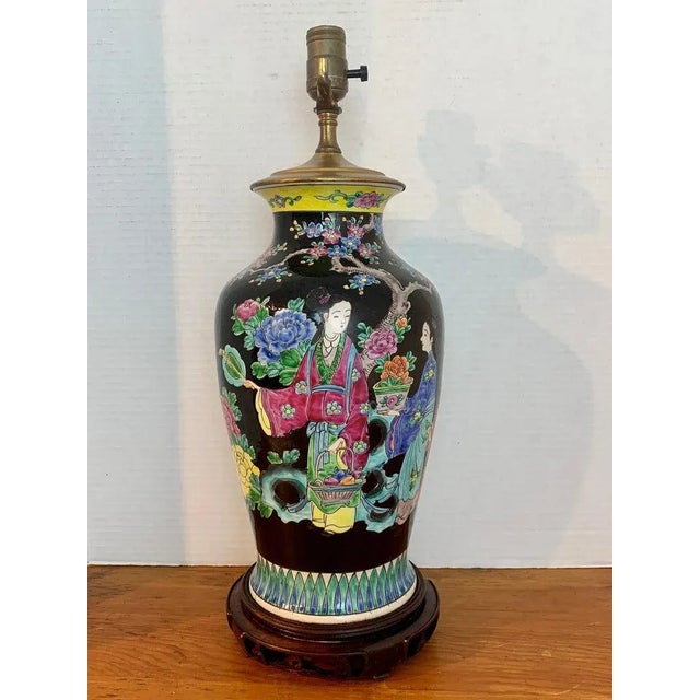 Japanese Vase with Black Background in the Style of Chinese Famille Verte. Well decorated with woman in a garden. No...