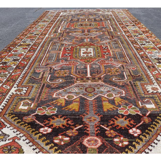 Antique Persian Bakhtiar Gallery Rug Featuring a Multi-Medallion Tribal Design For Sale - Image 12 of 16