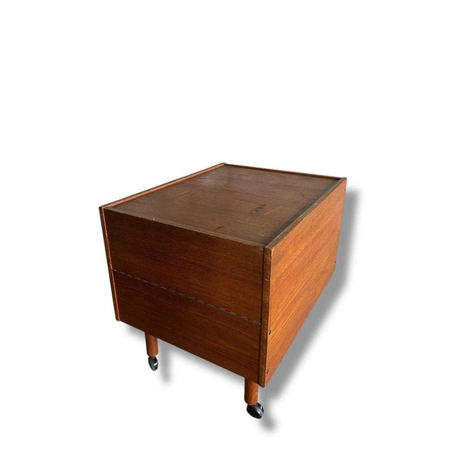 This mid century drinks cabinet combines vintage charm with practical design, offering a stylish solution for storing and...
