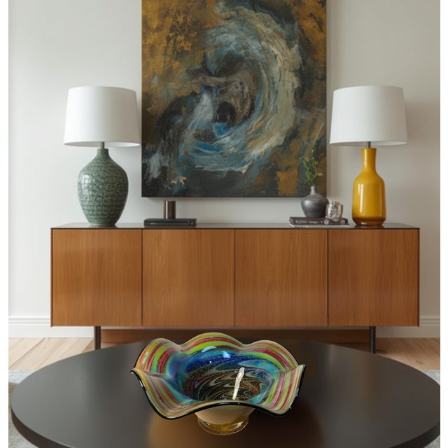 This commanding Murano hand‑blown art glass centerpiece bowl—measuring 17 × 17 inches wide and 8.5 inches tall—is a work...