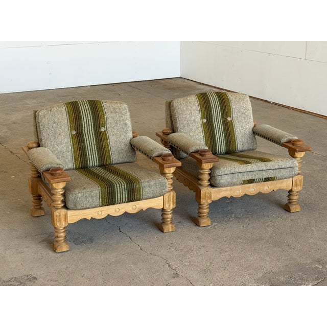 A pair of solid oak brutalist lounge chairs in the Scandinavian Modern tradition, attributed to Henning Kjærnulf and...