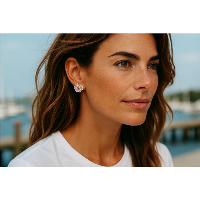 A charming blend of elegance and femininity, these pre-owned 14K yellow gold earrings feature a timeless floral design set...