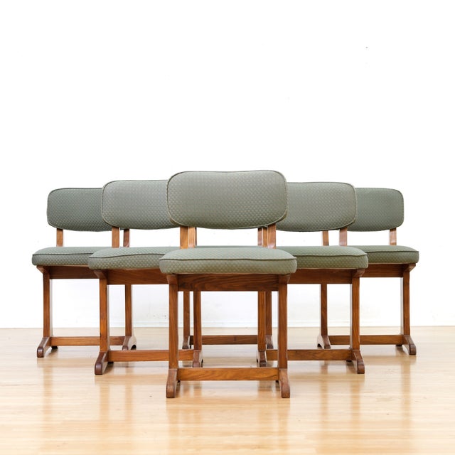 Set of six Danish dining chairs crafted in solid teak, featuring sculptural pedestal bases and clean Scandinavian lines....