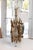 This is a striking organic modern table lamp crafted of sculptural cast brass, featuring an open cylindrical arrangement...