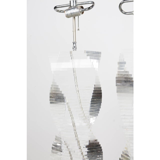Elegant two-light table lamps with thick stacked Lucite in helix form on chrome bases, with original large bevelled Lucite...