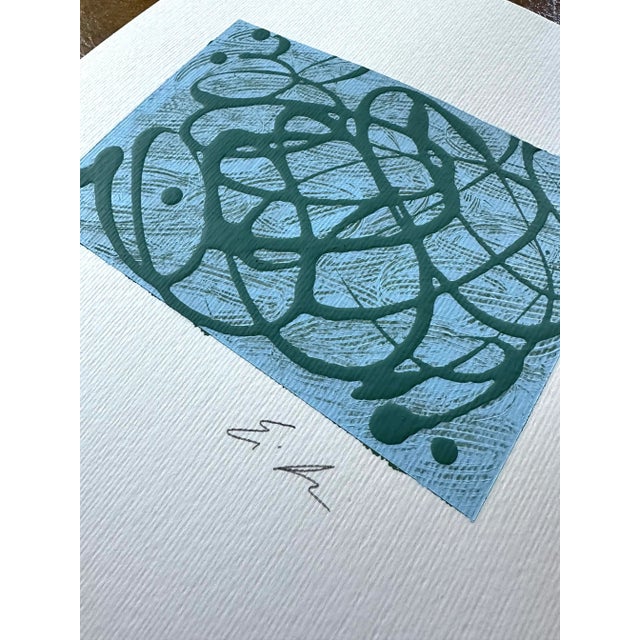 Light blue with raised green “Imperfections" with added base texture on paper. Signed on the front.