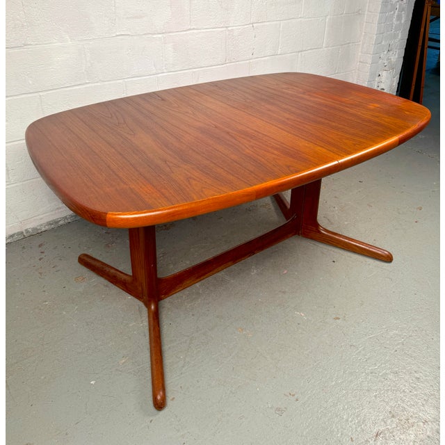Elevate your dining or living space with this beautifully crafted mid-century teak table by Rasmus, a stunning example of...