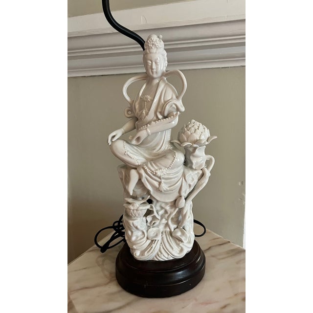 Fabulous blanc de chine Asian figural lamp with highly detailed accents. Tense Affixed to a custom wooden base and brass...