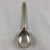 A sterling silver serving spoon in the classic Acorn pattern. Designed by Johan Rodhe for Jensen and introduced in 1915,...