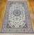 "This extremely fine hand knotted Persian Nain rug, crafted in the 4th quarter of the 1900s. Set on a soft ivory...