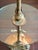A dramatic vintage Hollywood Regency floor lamp with an integrated round glass table, dating approximately to the late...