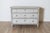 A beautiful 19th-century Swedish Gustavian-style commode, circa 1860, painted in a soft gray with a delicate hint of...