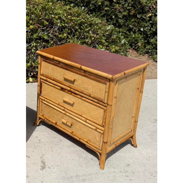 Vintage bamboo and grass cloth nightstand with a wood top. This listing is for the nightstand only with shipping to 32963...