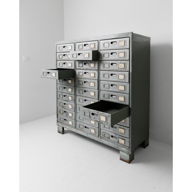 This vintage metal drawer cabinet from the 1960s is a truly unique industrial storage piece with authentic character and...
