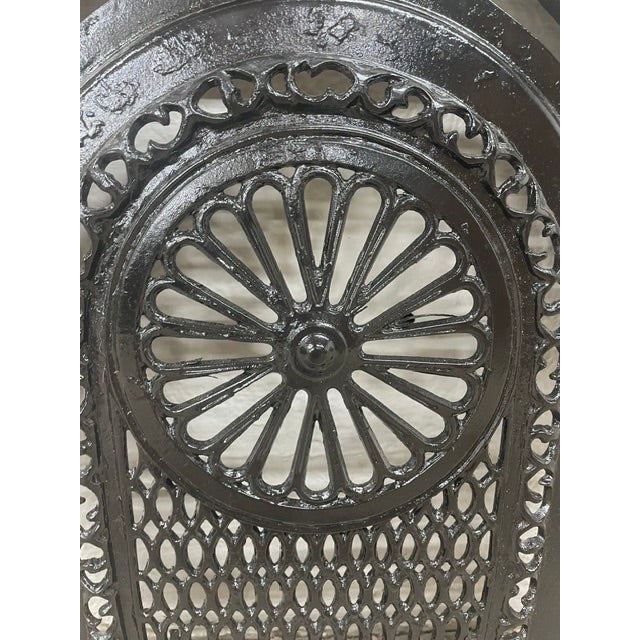 A remarkable piece of Southern architectural history, this late 19th-century cast iron fireplace surround and matching...