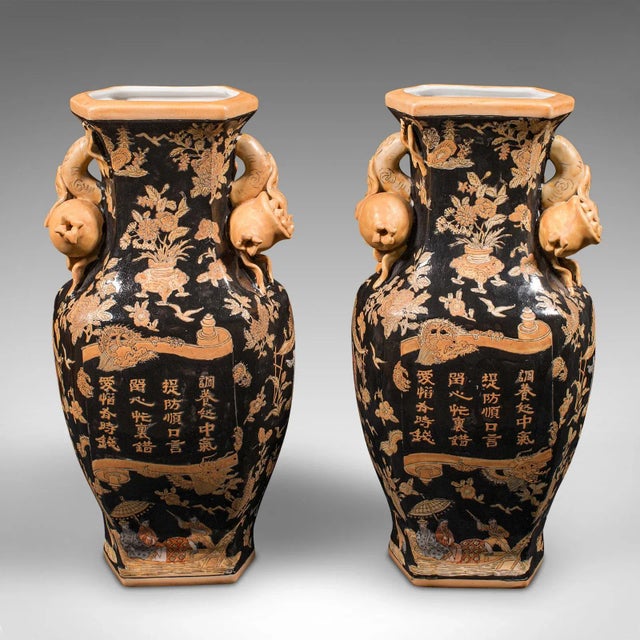 This is a pair of vintage decorative vases. A Chinese, ceramic tourist ware dried flower urn, dating to the late 20th...