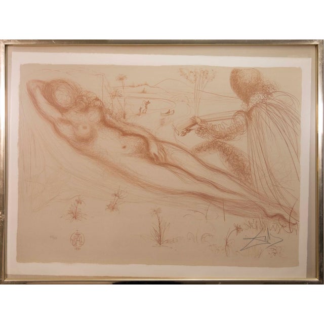 A modern lithograph on paper titled “Le Nu a la Guitarre (The Nude on the Guitar, Serenade)” by Salvador Dali. Hand signed...