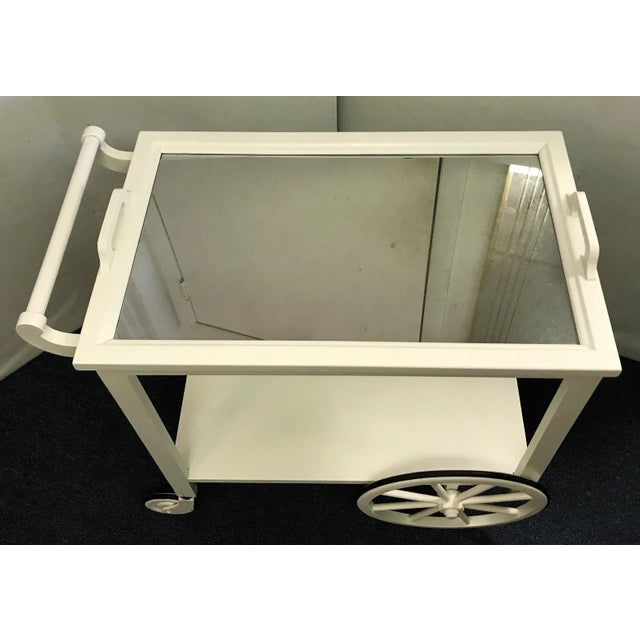 This is just the perfect little bar cart! The vintage bar cart is from the 1950's. It's made of wood with a removeable...