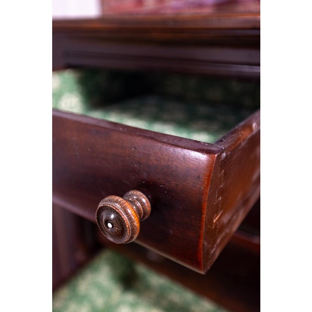 A handsome antique American Empire Revival chest of drawers dating to approximately the turn of the 20th century. This...