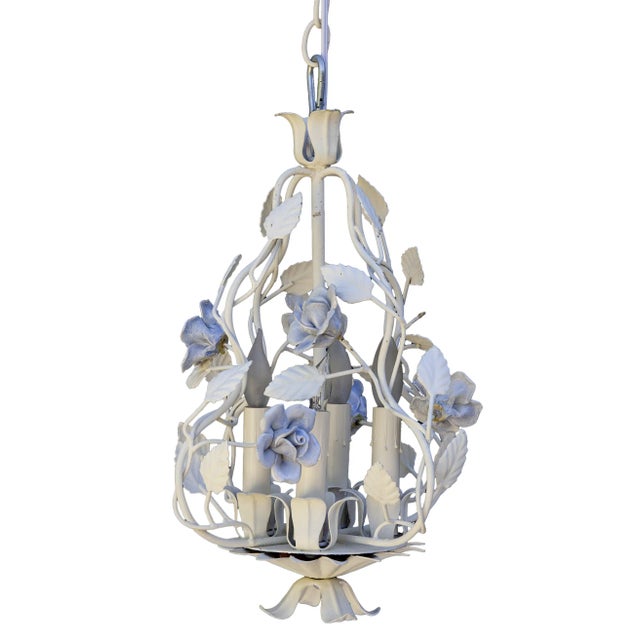 A tole chandelier with cornflower blue ceramic flowers. There are finger impressions on each hand made petal. Freshly...