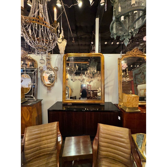 This large 19th century French Louis Philippe gilded wood floral mirror exudes elegance and sophistication. The intricate...