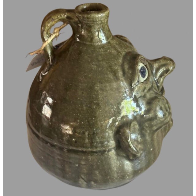 This 25 year old Face Jug was created by Grace Nell Hewell from Gillsville Georgia and comes from a family of folk artists...