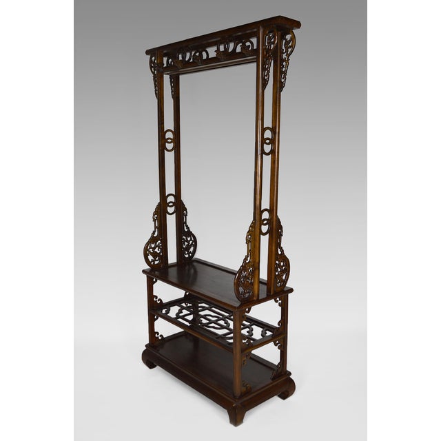 Asian coat rack in carved wood. Carved wood, carved coat hooks in the shape of dragons. Central bar for clothes hangers. 3...