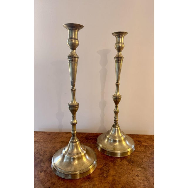 Quality pair of large antique Victorian brass candlesticks, having a quality large pair of brass candlesticks with tuned...