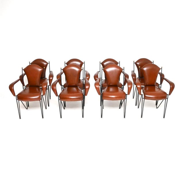 An outstanding set of eight vintage leather and steel dining chairs by Frederic Weinberg. They were made in the USA, they...