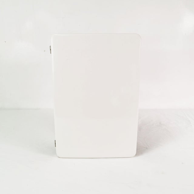 Wall cabinet, Italy, 1970s. It features a minimalist, understated design. Made of Bakelite (a solid, heavy, thick...