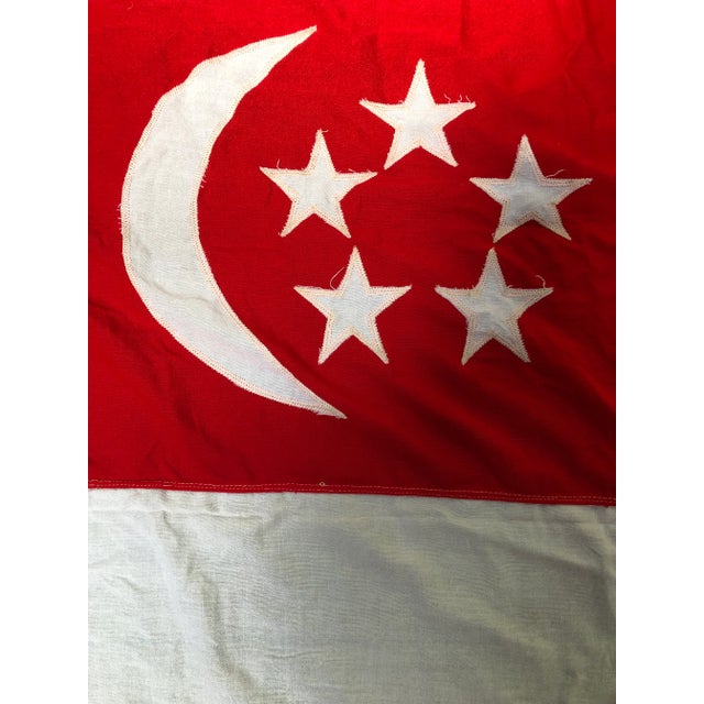 A colorful vintage cotton nautical flag of Singapore with bold graphics, actually flown on and salvaged from a ship....