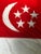 A colorful vintage cotton nautical flag of Singapore with bold graphics, actually flown on and salvaged from a ship....