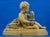 a magnificent terracotta sculpture depicting the infant bacchus with a bunch of grapes and a cup, signed "b. Rezl," dating...