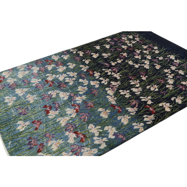 Hand-knotted wool, this 5x7 contemporary rug draws inspiration from botanical designs—where a mix of blues with floral...