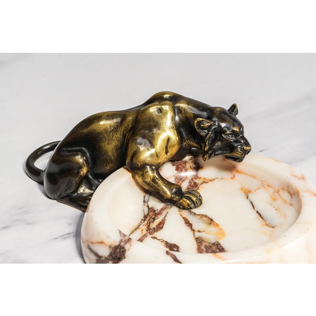A striking embodiment of Art Deco elegance, this antique panther catchall captures the bold spirit and refined glamour of...