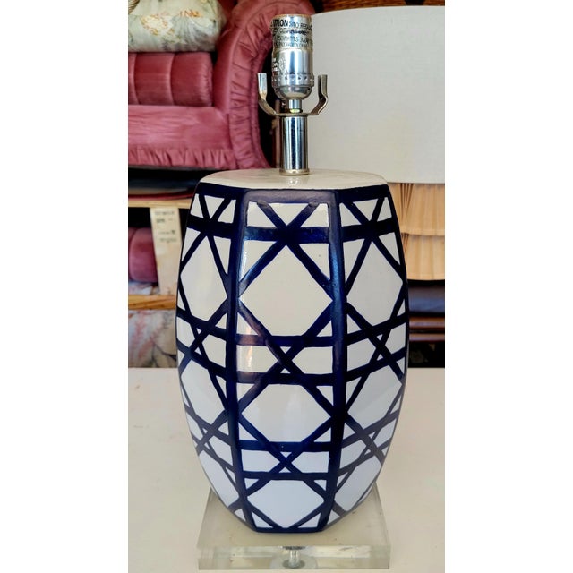 A gorgeous navy blue and white ceramic table lamp in a fabulous crosshatch or lattice basket weave design. The lamp is...