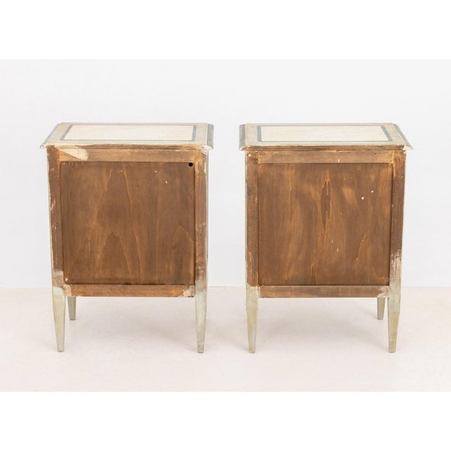 Pair of Venetian Style Painted Bedside Tables, with ribbon and bow form motif, three drawers on four tapered legs. 28.25"...