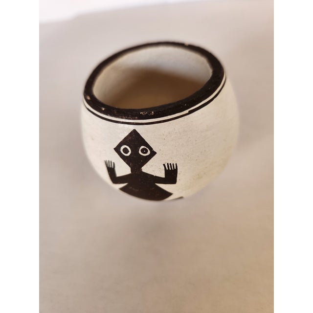 This small (2 ½” d, 2 ¼” h) yet stunning Acoma Pueblo bowel will catch the attention of the well discerned eye. Two hand-...