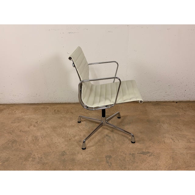 EA 117 Aluminium Desk Chair in White Leather and Chrome by Charles and Ray Eames for Vitra, in Good conditions. Designed...