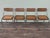 Set of 4 Italian-design chairs from the 1970s. They have a chromed metal frame. The seats and backrest are made of wood...