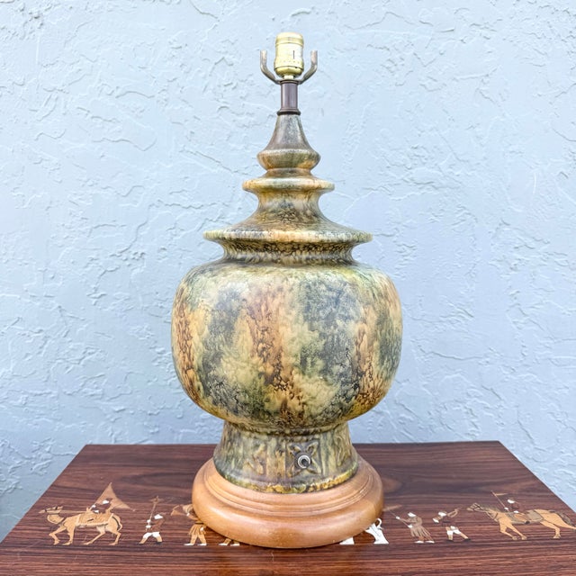 This vintage ceramic table lamp brings warm, organic character to any interior with its rich earth-tone palette. The...