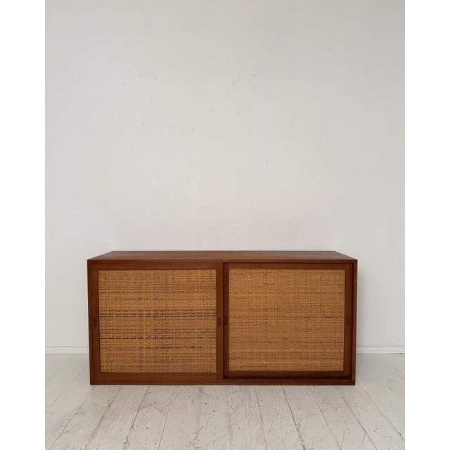 Designed by Hans J. Wegner for Ry Møbler, this iconic Ry26 sideboard is a refined example of Danish Modern design from the...